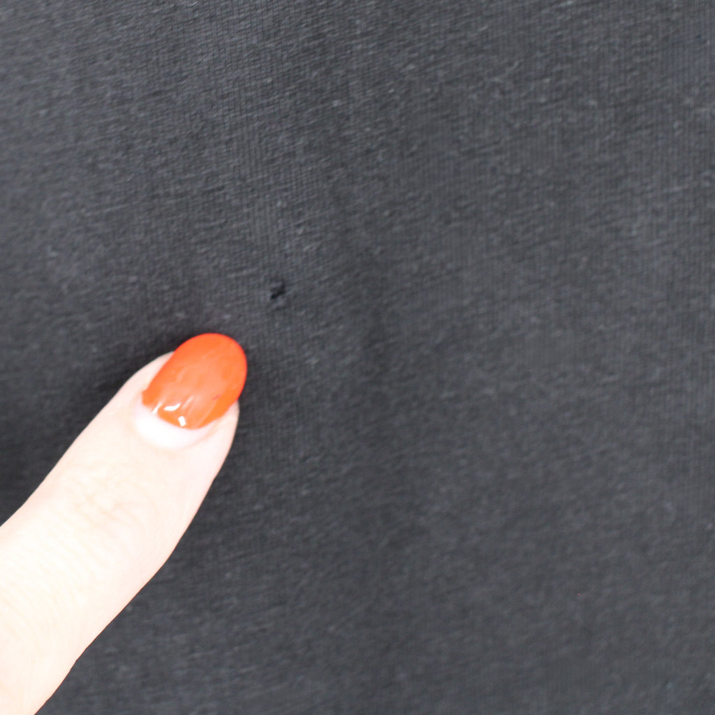 small intentional vintage-effect hole detail