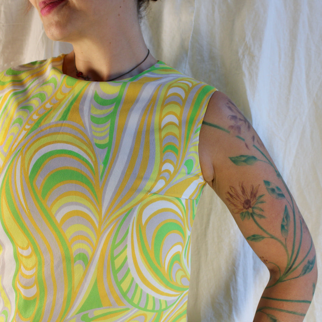 Front view of yellow green psychedelic sheath dress