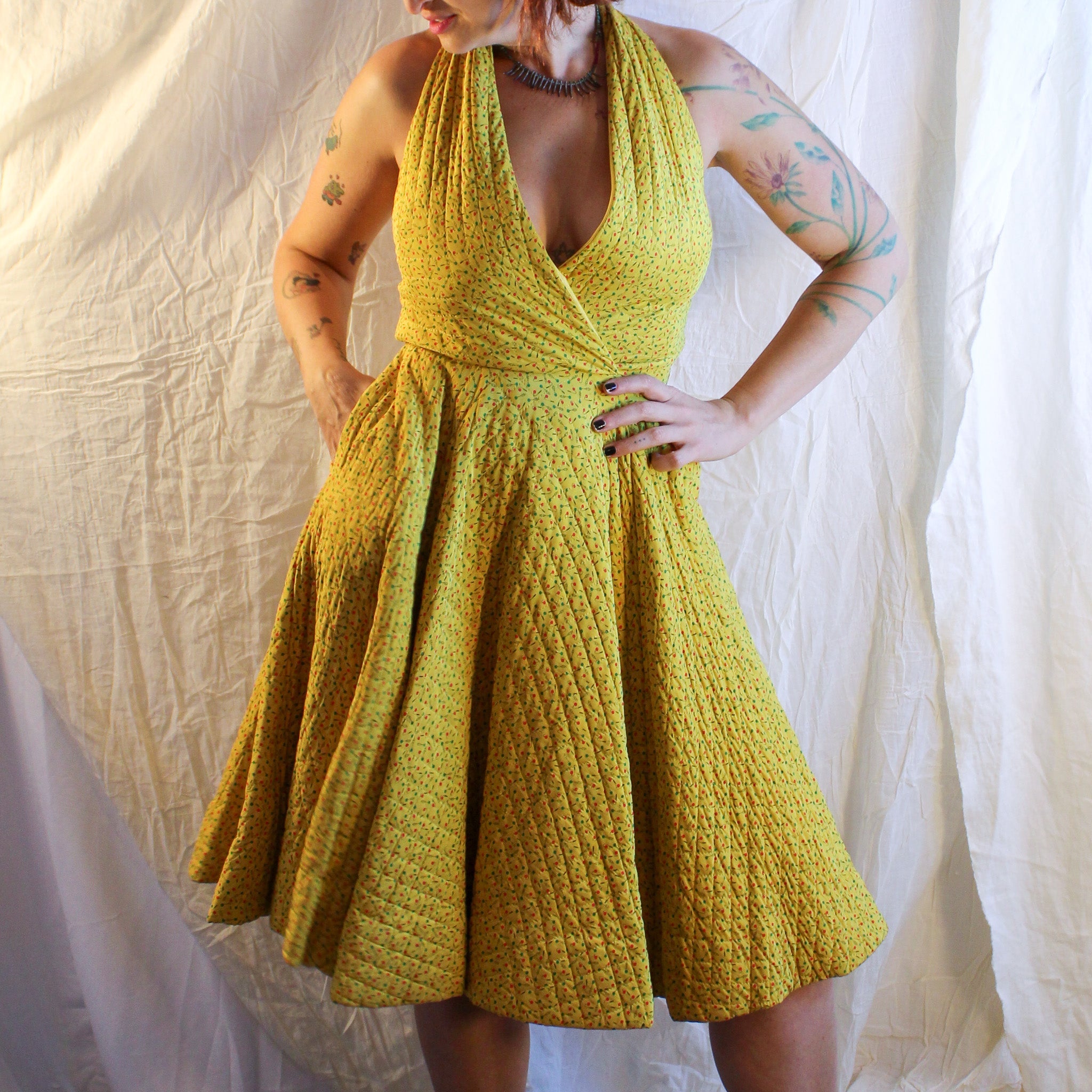 Front on model, quilted halter circle dress